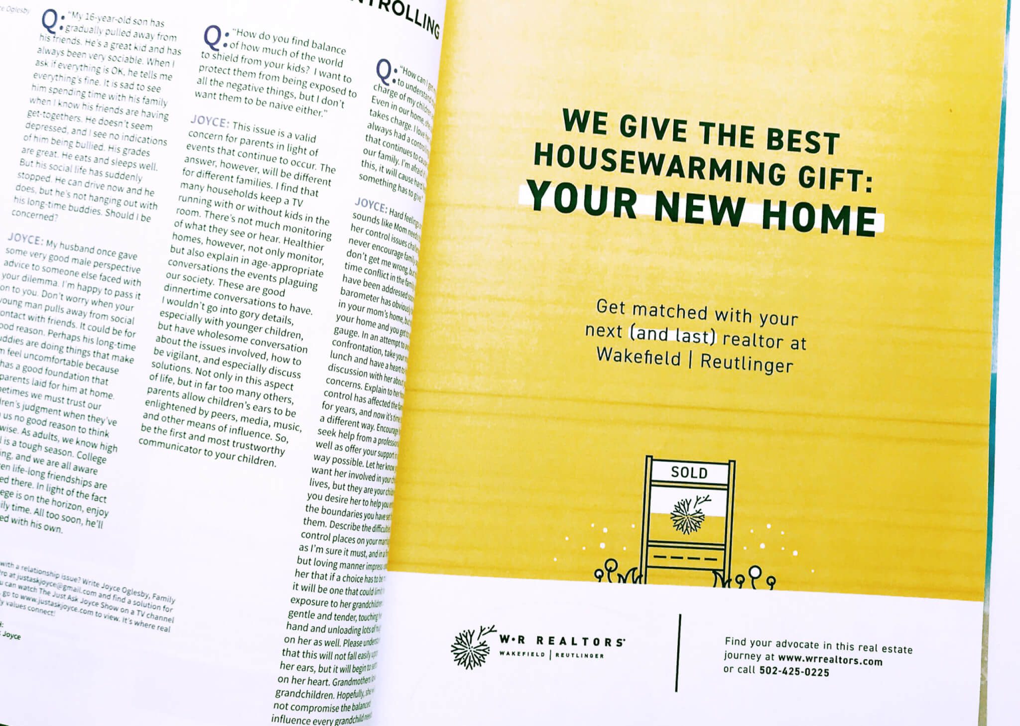 Magazine spread showing an ad with yellow background reading We give the best housewarming gift: your new home, promoting Wakefield Reutlinger Realtors, with a house icon and contact information.