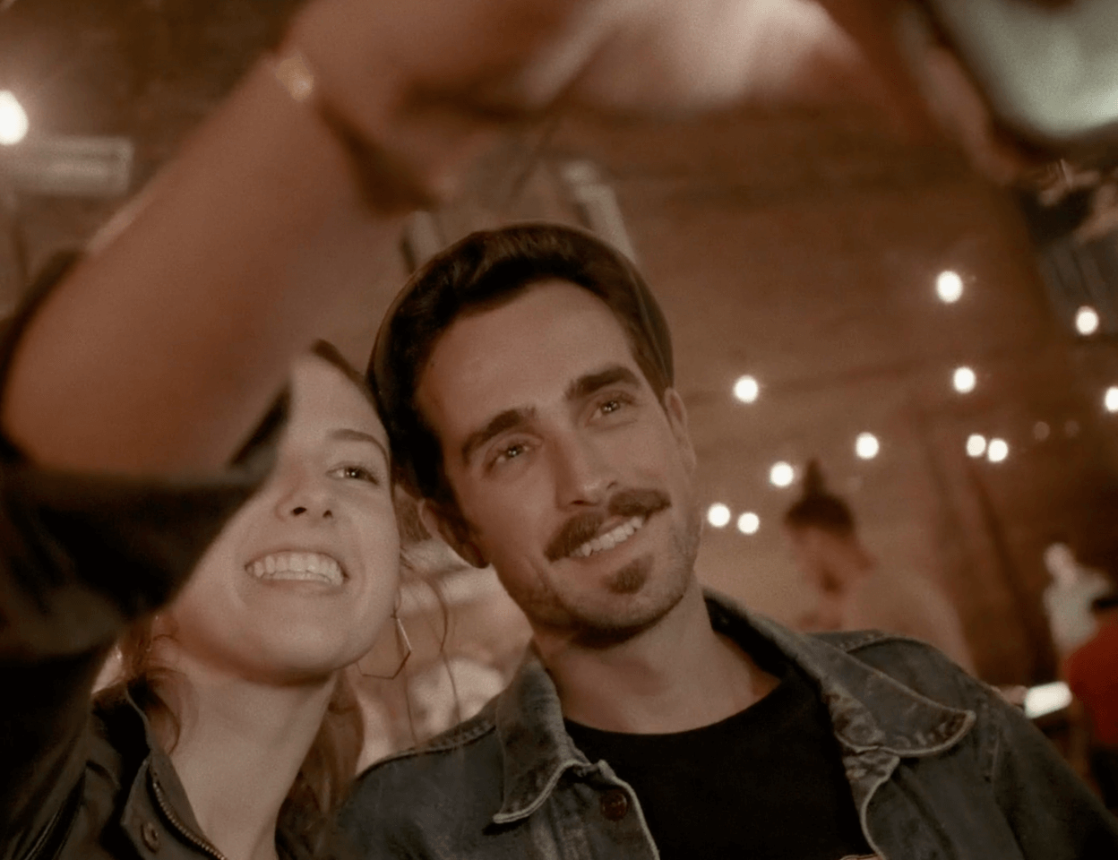 Two people taking a selfie for the Do Something Machine