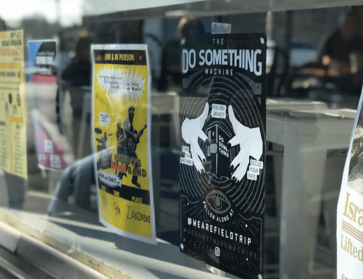 Do Something Machine poster in window