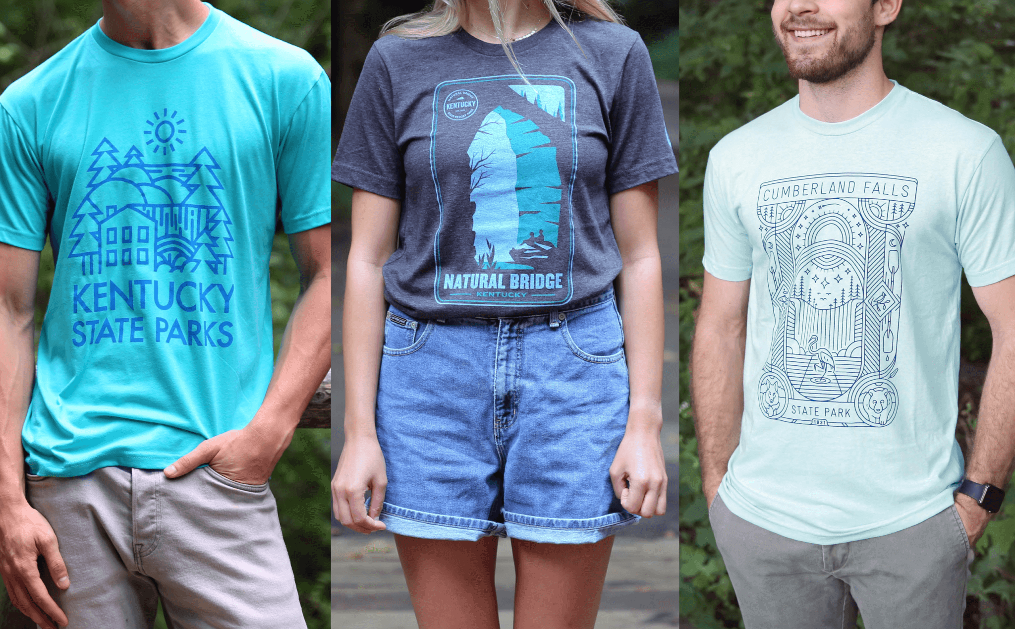 Three people stand side by side wearing graphic t-shirts featuring Kentucky state parks designs: Kentucky State Parks, Natural Bridge, and Cumberland Falls. The background is outdoors with greenery.