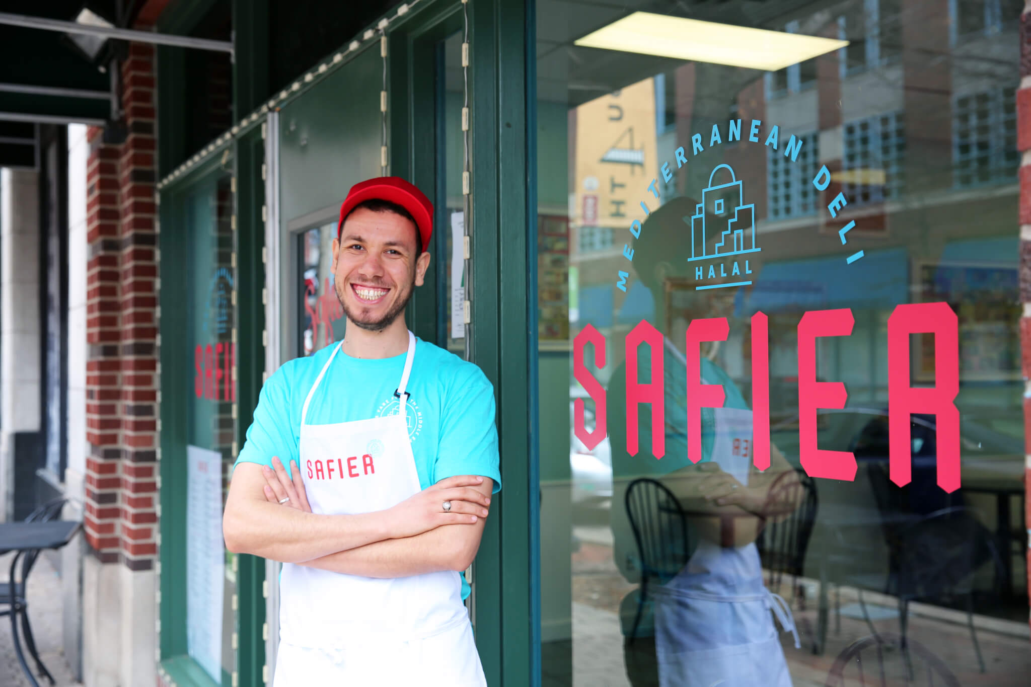 Youness, owner, standing in front of Safier