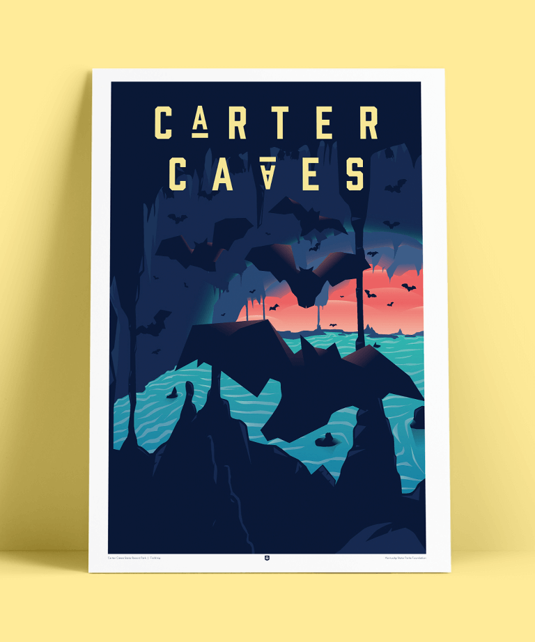 A stylized poster of Carter Caves shows dark cave formations, flying bats, and a pastel sunset over water, with bold yellow text CARTER CAVES at the top and bottom against a pale yellow background.