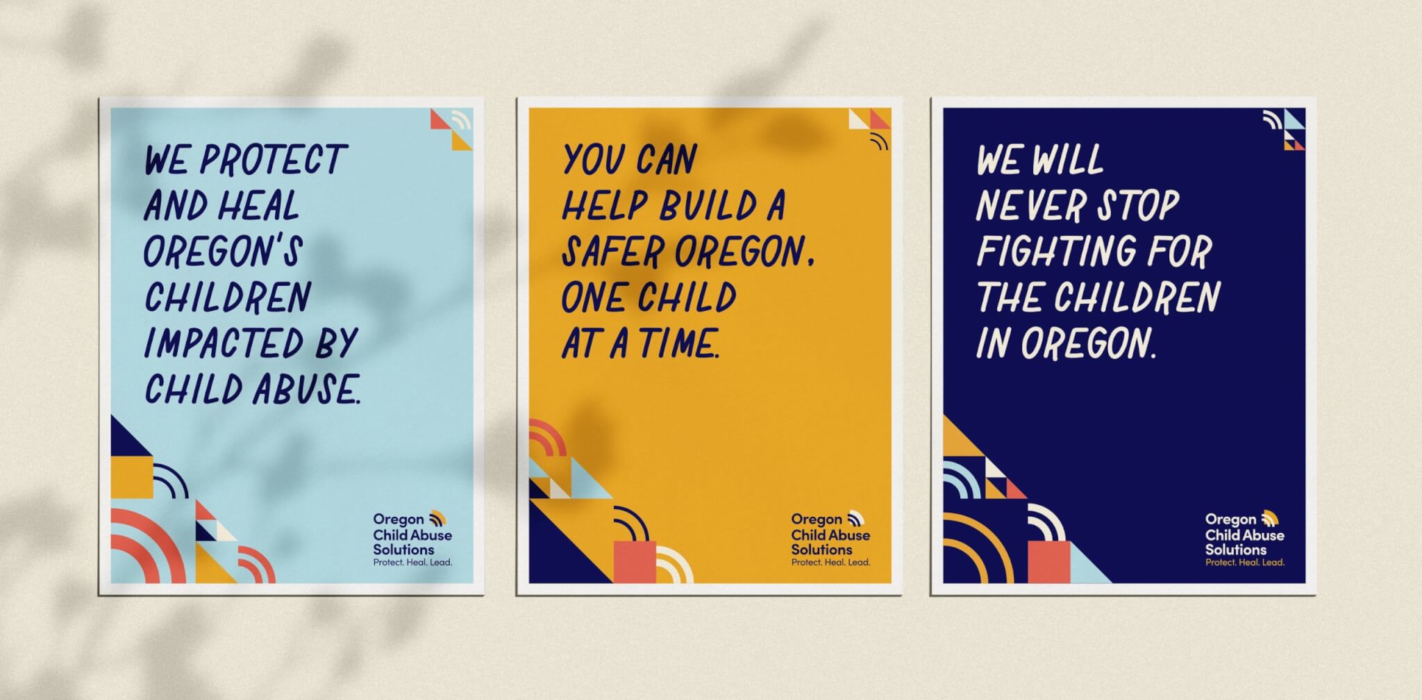 Three posters with bold text promoting Oregon Child Abuse Solutions. Messages read: “We protect and heal Oregon’s children impacted by child abuse,” “You can help build a safer Oregon. One child at a time,” and “We will never stop fighting for the children in Oregon.”.