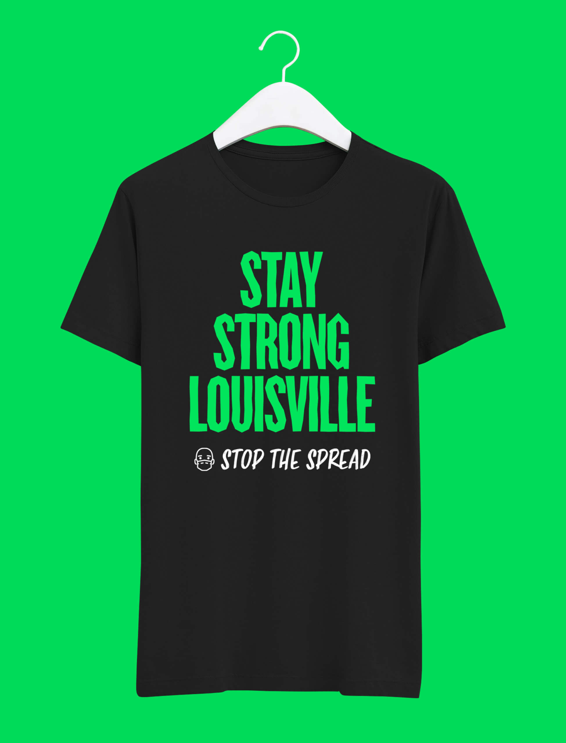 A black T-shirt on a white hanger reads “STAY STRONG LOUISVILLE STOP THE SPREAD” in bold green and white text, with a small masked face icon below the lettering, against a bright green background.