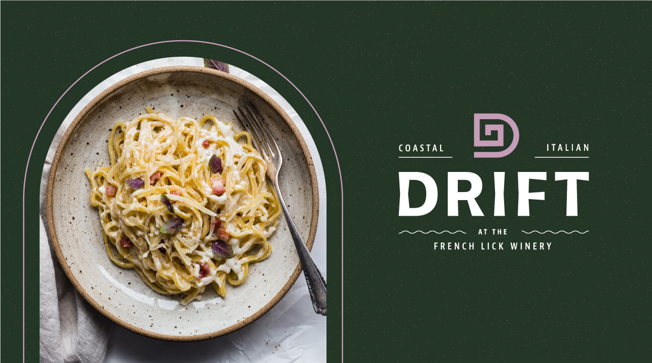A bowl of creamy pasta with bits of bacon sits on a speckled plate. Next to it is the Drift restaurant logo with the text “Coastal Italian Drift at the French Lick Winery” on a dark green background.