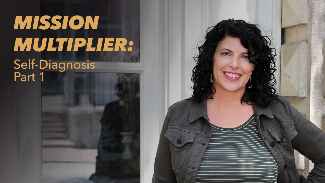 A woman with curly dark hair smiles while standing outside near a building. Text on the left reads MISSION MULTIPLIER: Self-Diagnosis Part 1.
