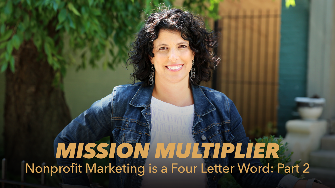 A woman with curly dark hair, wearing a blue jacket and white top, stands outdoors smiling. Text overlay reads: Mission Multiplier: Nonprofit Marketing is a Four Letter Word: Part 2.