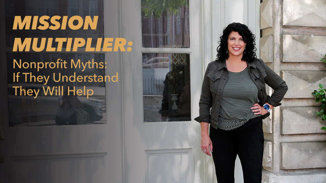 A woman with curly dark hair stands smiling in front of a doorway. Text on the image reads, MISSION MULTIPLIER: Nonprofit Myths: If They Understand They Will Help.