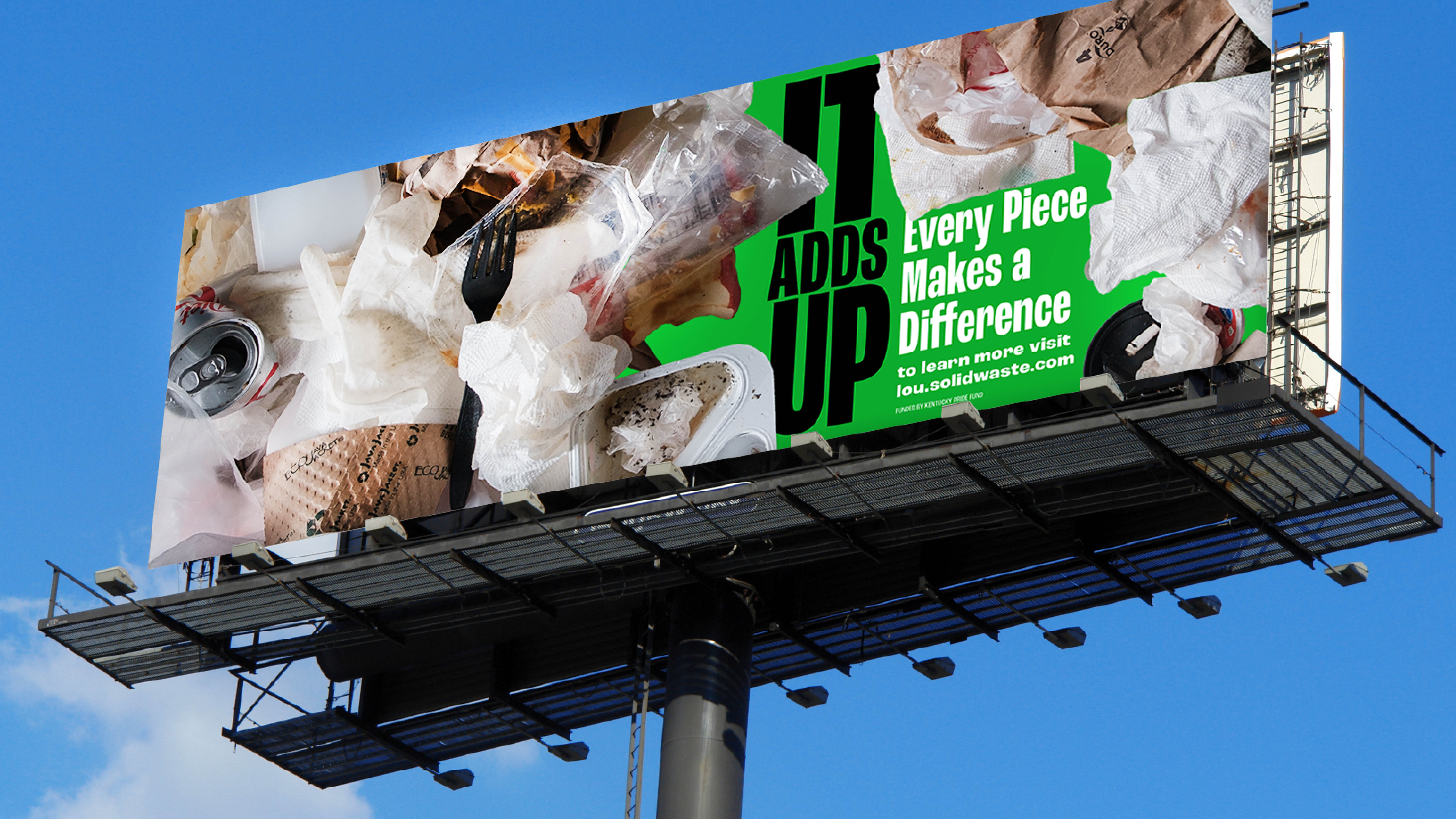 A billboard with images of food wrappers, cups, and napkins reads, “IT ADDS UP. Every Piece Makes a Difference. To learn more visit los.solidwaste.com” on a green and white background.