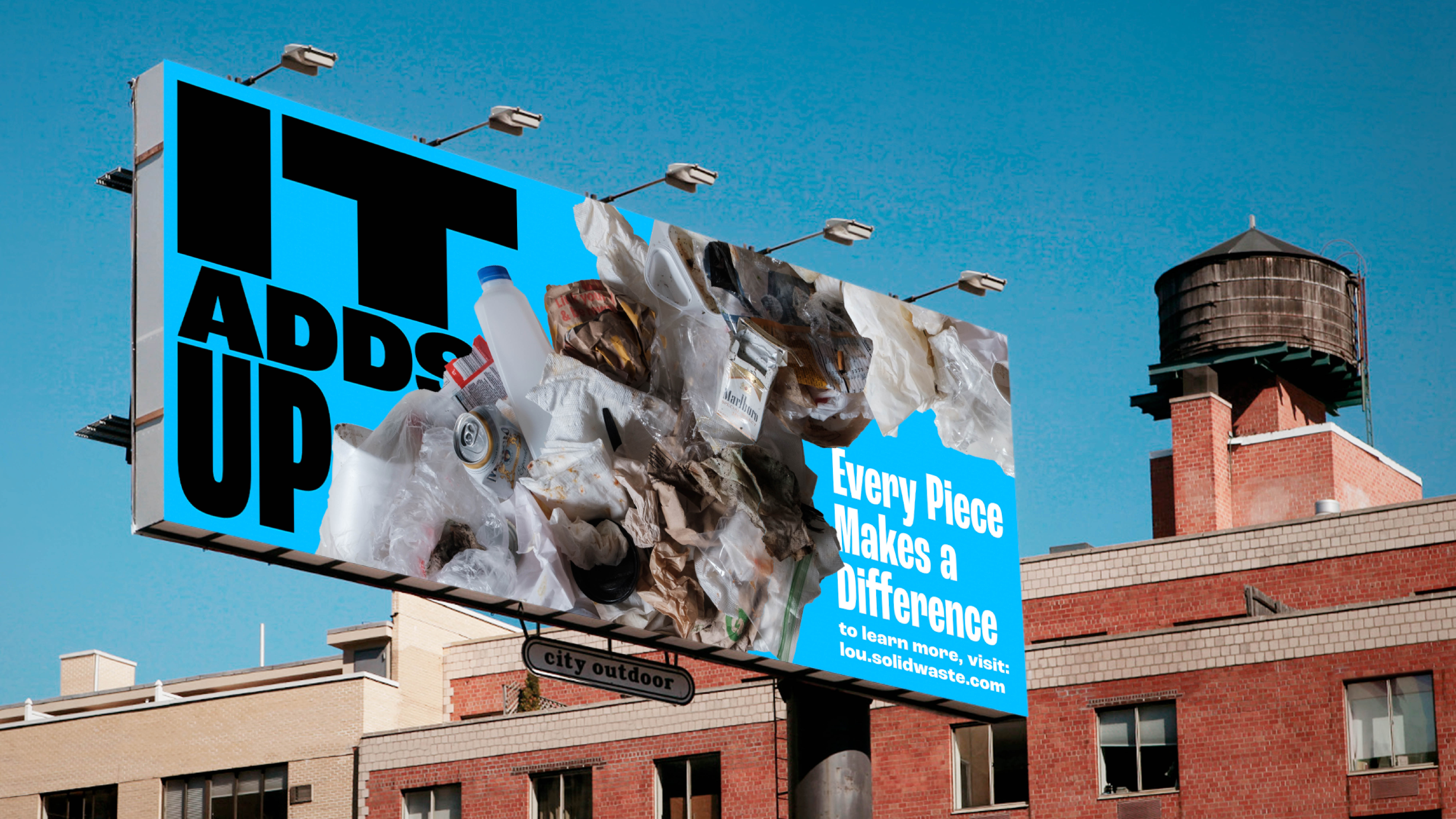 A billboard shows a pile of trash, including bottles and cans, with the text IT ADDS UP and Every Piece Makes a Difference. To learn more, visit sol.solidwaste.com. A brick building and water tower are in the background.