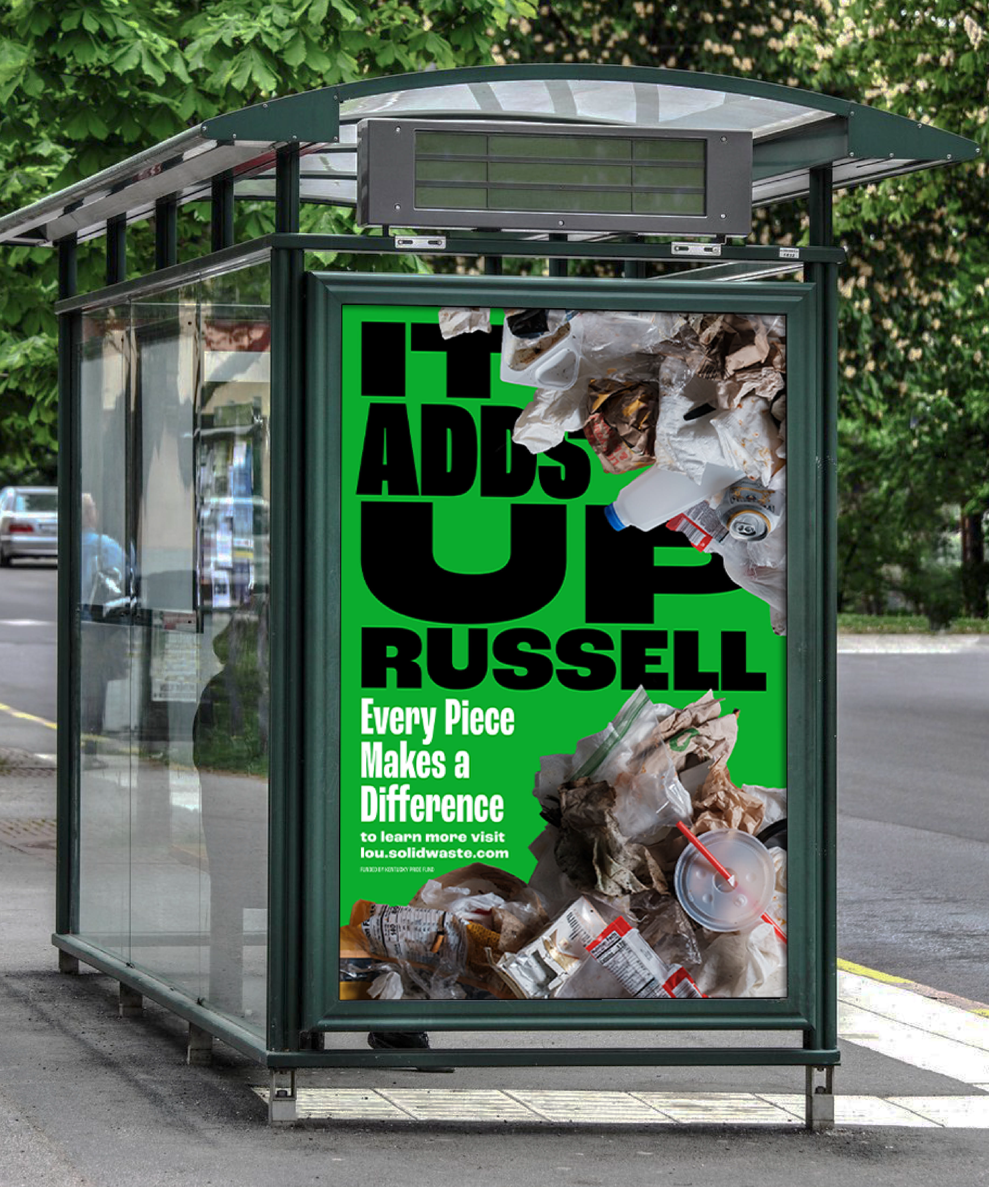 A bus stop advertisement features piles of trash covering a green background with the text: IT ADDS UP RUSSELL. Every Piece Makes a Difference. To learn more visit lou.solidwaste.com.