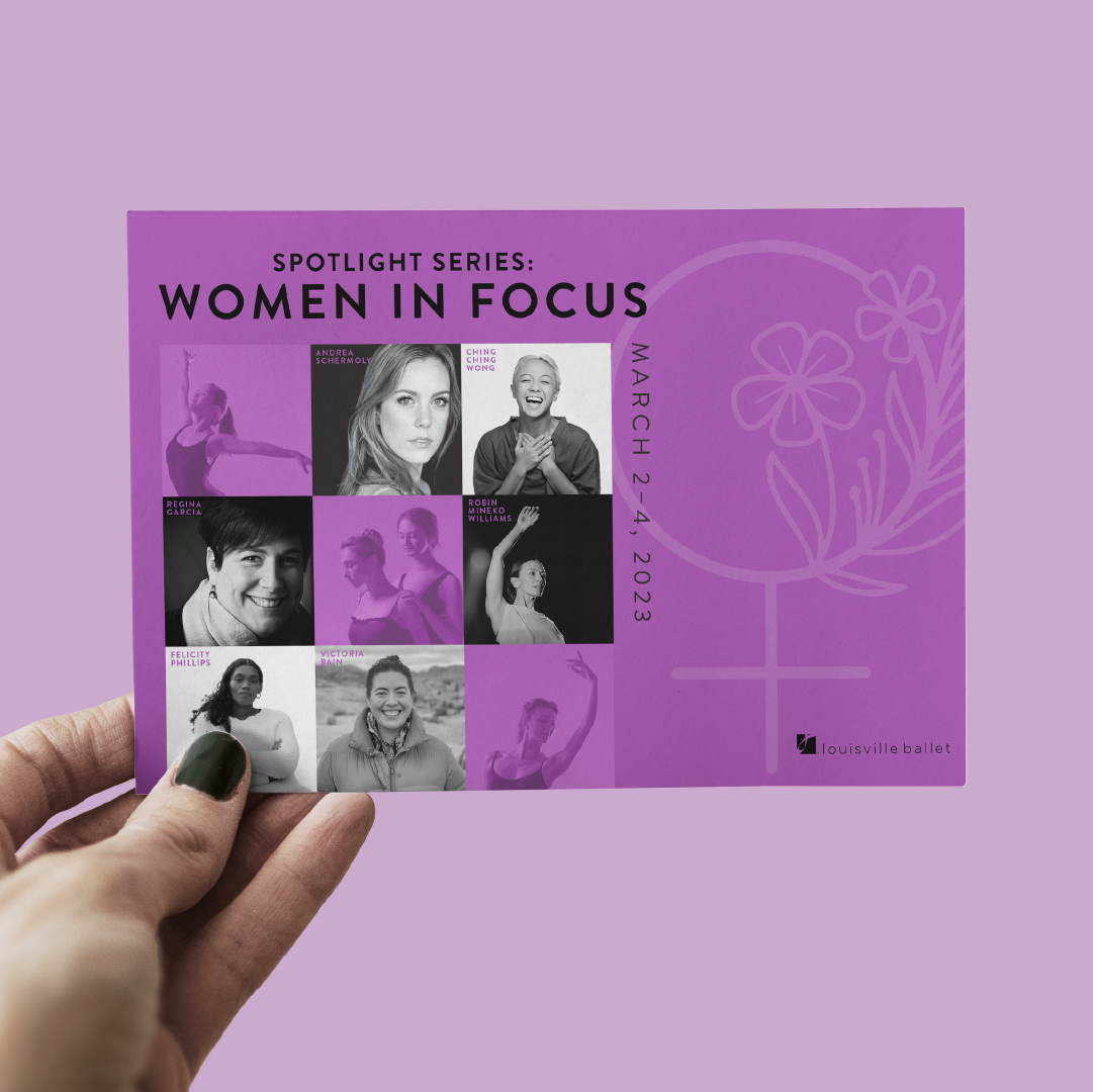 A hand holds a purple flyer featuring nine black-and-white portraits of women. The text reads Spotlight Series: Women in Focus, March 2-4, 2023 with a floral female symbol and the Louisville Ballet logo.