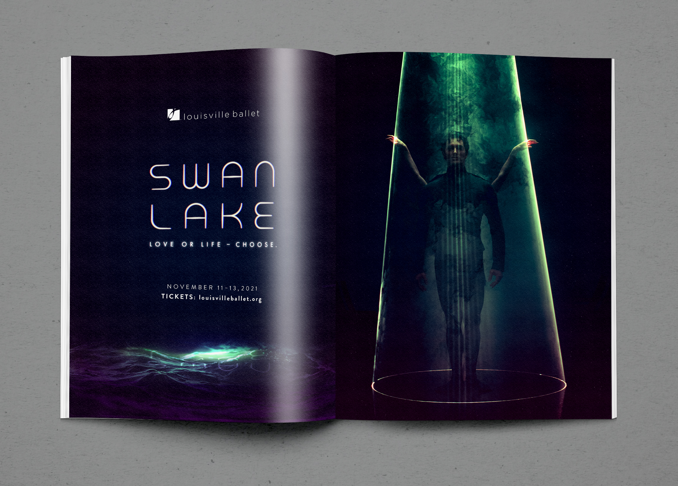 An open magazine shows a Swan Lake ad. The left page has the title, Swan Lake, and event details on a dark background with water-like effects. The right page features a dancer posed inside a glowing, cone-shaped beam of light.