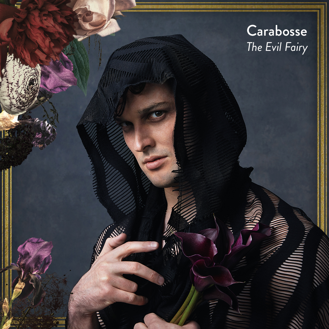 A person draped in black mesh fabric holds dark calla lilies, gazing intensely. Floral arrangements frame the top left of the image. Text reads: Carabosse The Evil Fairy on a gray background.