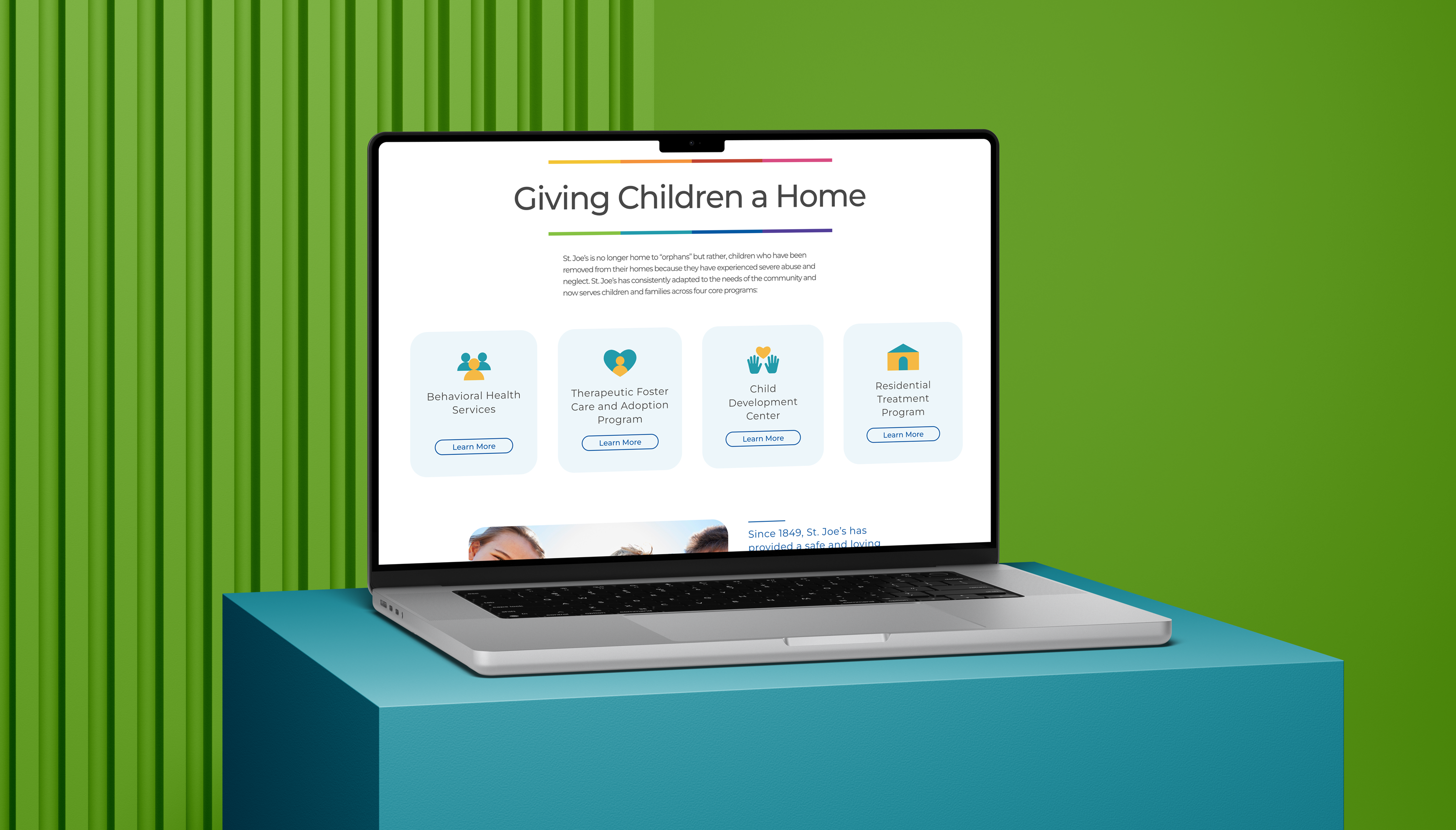A laptop on a blue pedestal displays a website titled Giving Children a Home, featuring sections on behavioral health services, foster care and adoption, child development, and residential treatment programs. Green striped background.
