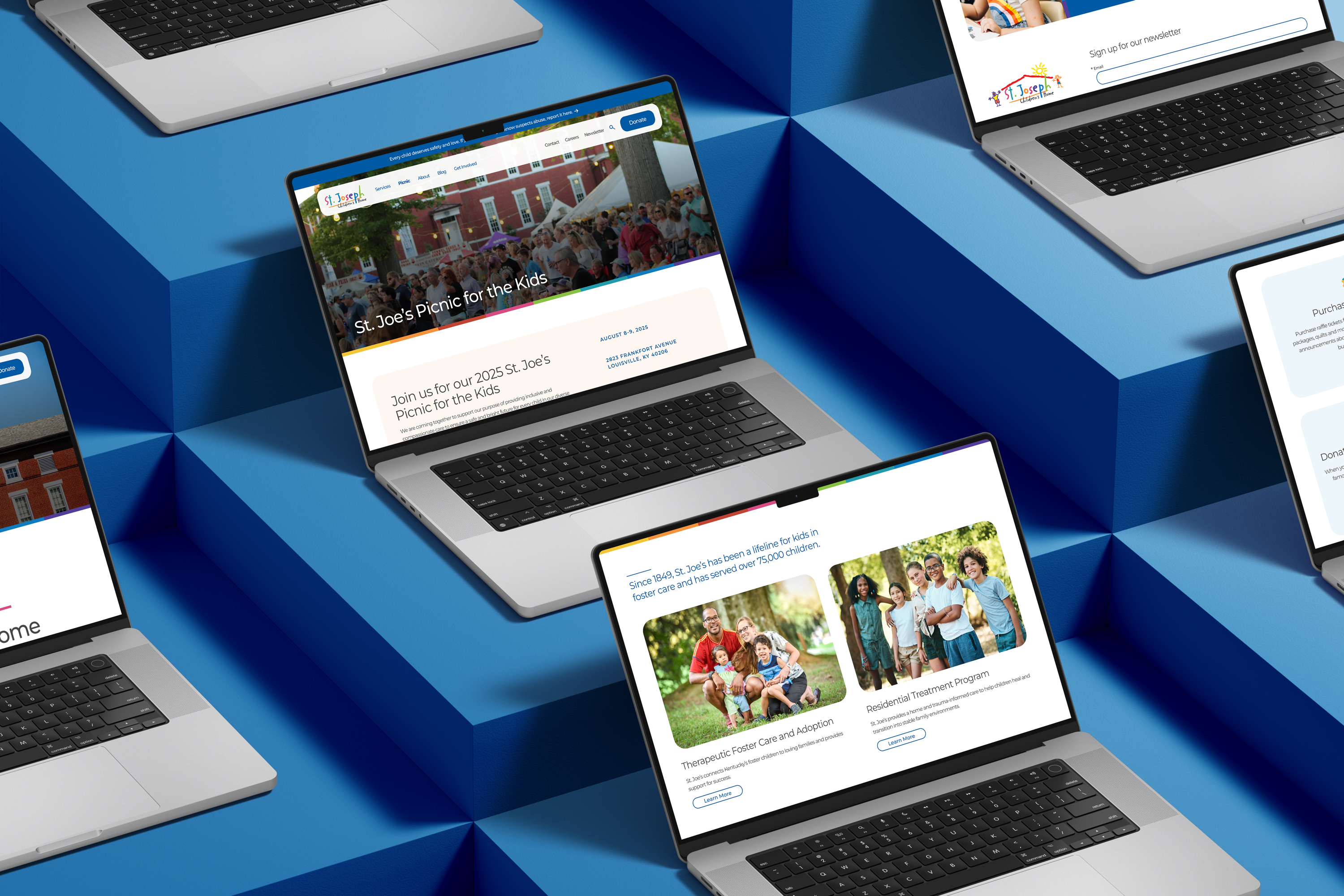 Several open laptops displayed on a geometric blue surface, each showing colorful websites with images of families, children, and event announcements on their screens.